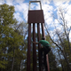 An unidentified climber scales the replica.